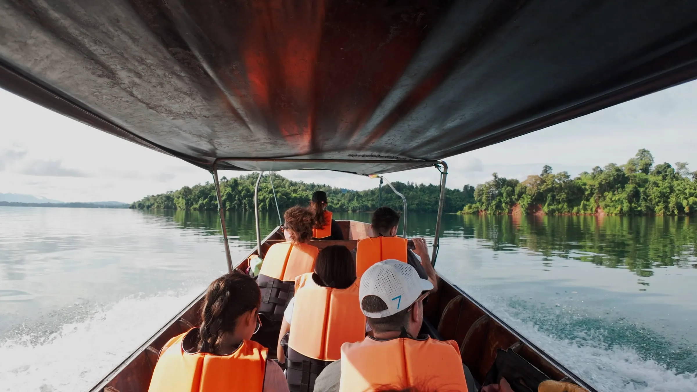 The view ahead from a long-tail boat crossing the open lake.